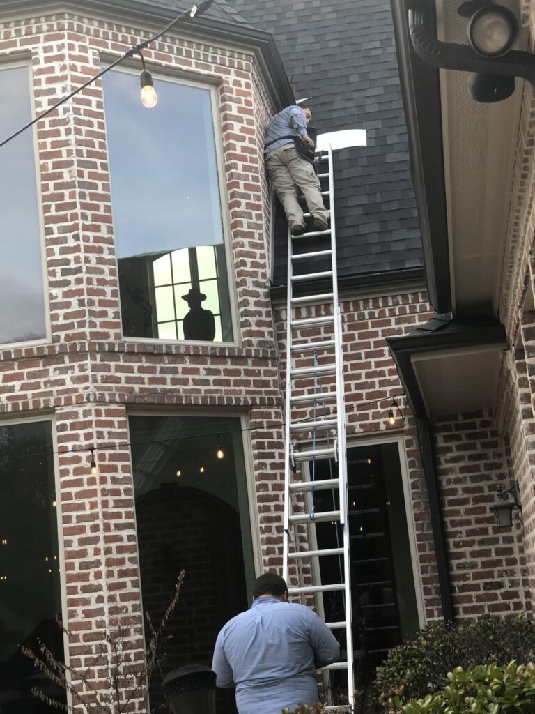 Simply Safe Pest technicians sealing rodent entry points from 2 story home.